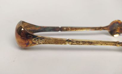 12 mocha spoons and sugar tongs in silver...