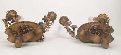 Pair of sconces in metal with subject in...