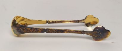 12 mocha spoons and sugar tongs in silver...