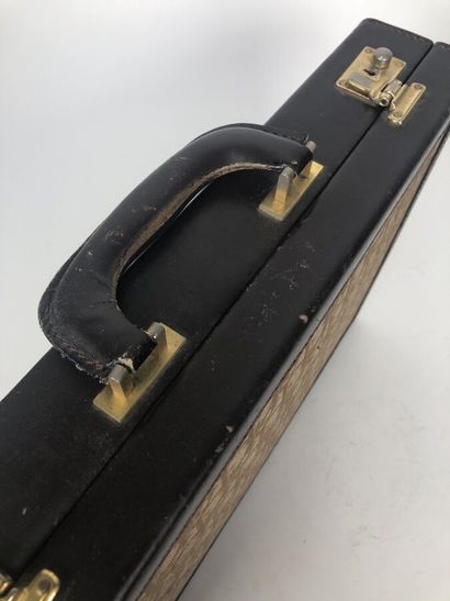 CHRISTIAN DIOR
Brown leather and signed canvas...