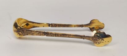 12 mocha spoons and sugar tongs in silver...