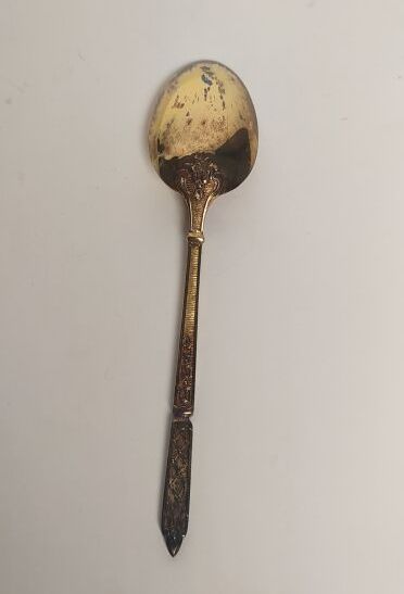 12 mocha spoons and sugar tongs in silver...