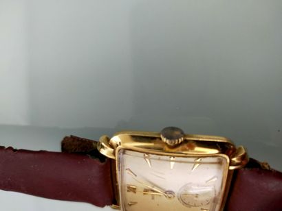 ROLEX
Rectangular men's watch in 18K yellow...