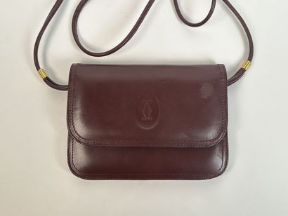 CARTIER -
Shoulder bag in burgundy leather,...