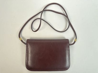 CARTIER -
Shoulder bag in burgundy leather,...