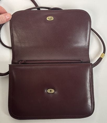 CARTIER -
Shoulder bag in burgundy leather,...