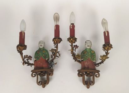 Pair of sconces in metal with subject in...