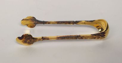 12 mocha spoons and sugar tongs in silver...