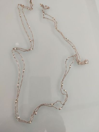 White gold long necklace decorated with small...
