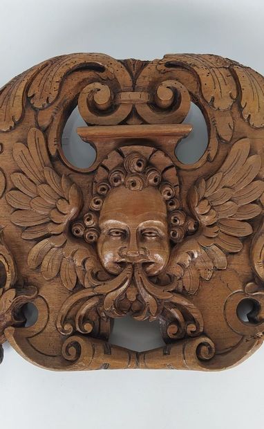 Sculpture on wood with cherub in bas-relief....