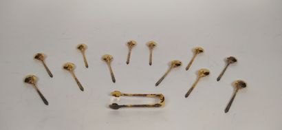 12 mocha spoons and sugar tongs in silver...