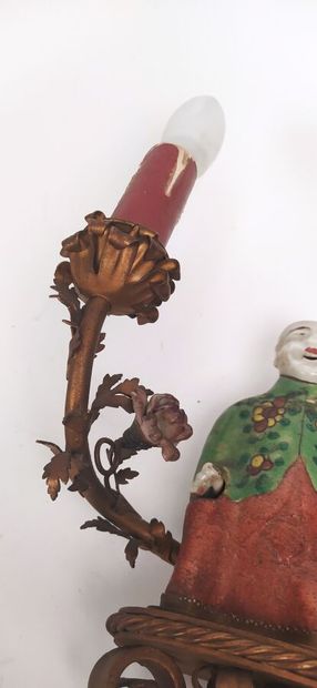 Pair of sconces in metal with subject in...
