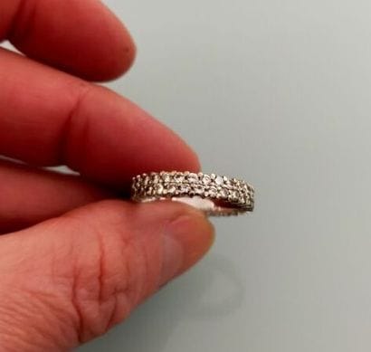 American wedding band in grey set with diamonds
Gross...