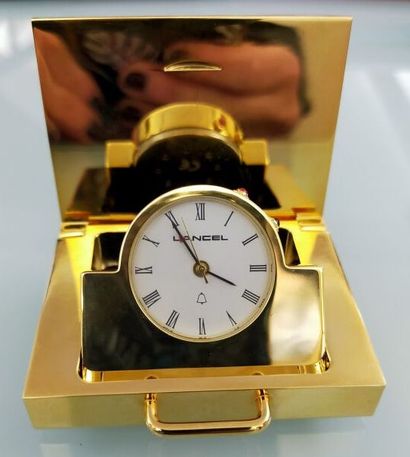 LANCEL
Travelling clock in gilded metal
Height...