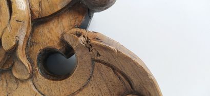 Sculpture on wood with cherub in bas-relief....