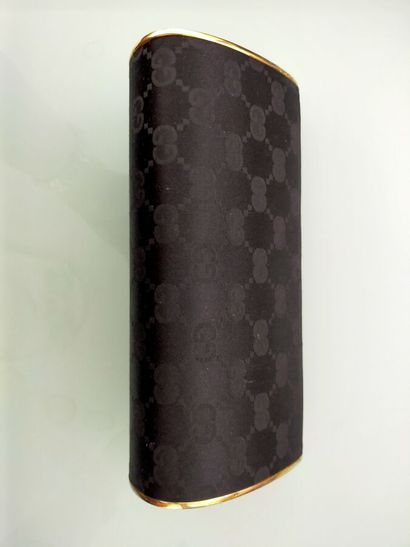 GUCCI
Evening clutch, gilded metal and black...