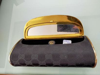 GUCCI
Evening clutch, gilded metal and black...
