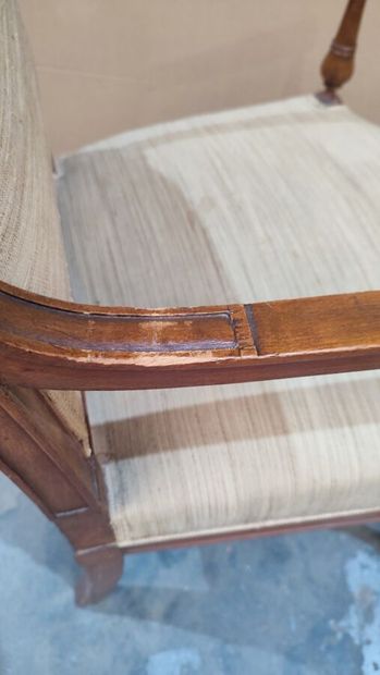 Carved molded natural wood armchair in the...