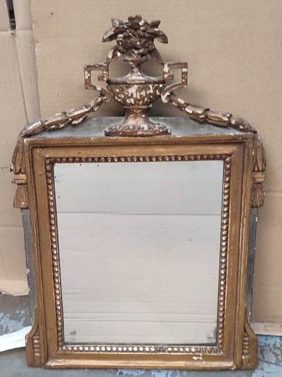 Louis XVI style wood and gilded stucco mirror
(Misses...