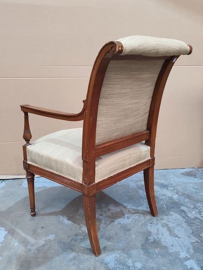 Carved molded natural wood armchair in the...