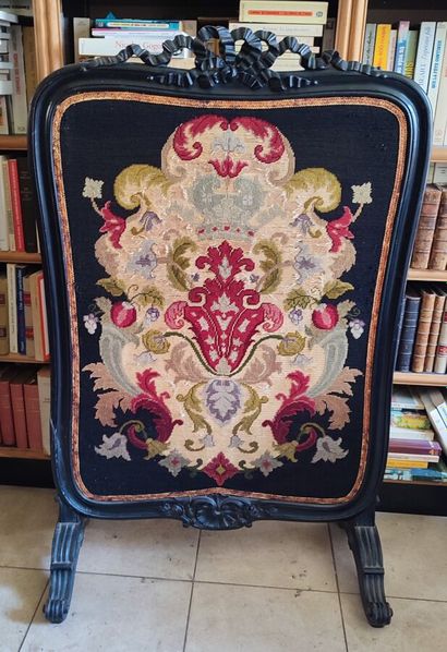 Moulded blackened wood fire screen, embroidered...