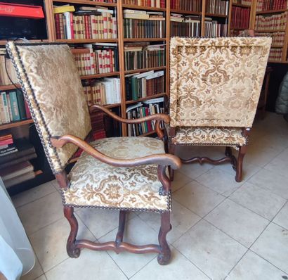 Two walnut armchairs, crosse arms, Louis...