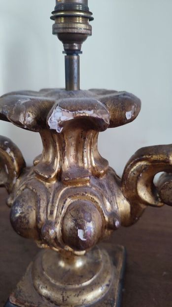 Pair of partially gilded wooden lampstands
Louis...