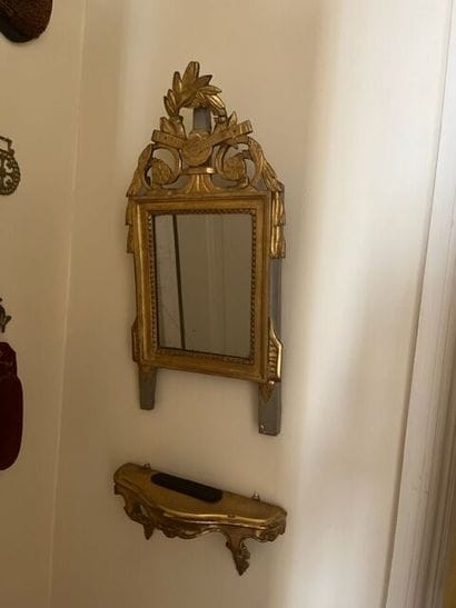 Small rectangular gilded wood mirror topped...