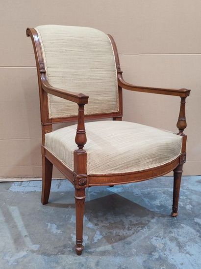 Carved molded natural wood armchair in the...