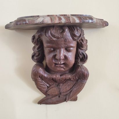 Pair of wall brackets in carved wood decorated...
