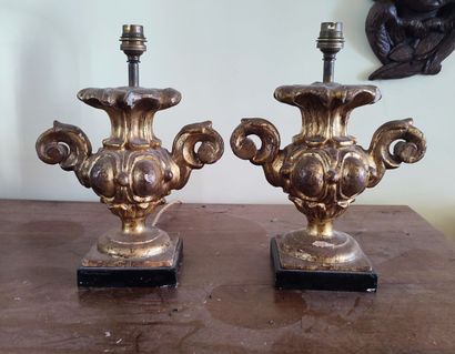 Pair of partially gilded wooden lampstands
Louis...