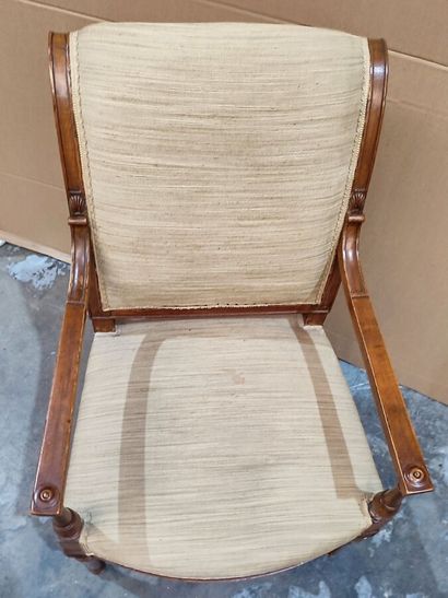 Carved molded natural wood armchair in the...