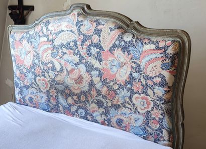 Grey lacquered wood bed trimmed with blue...