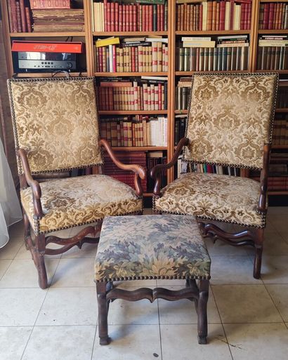 Two walnut armchairs, crosse arms, Louis...