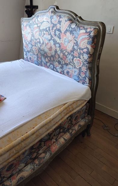 Grey lacquered wood bed trimmed with blue...