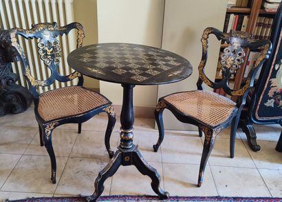 Set including a pedestal table with a black...
