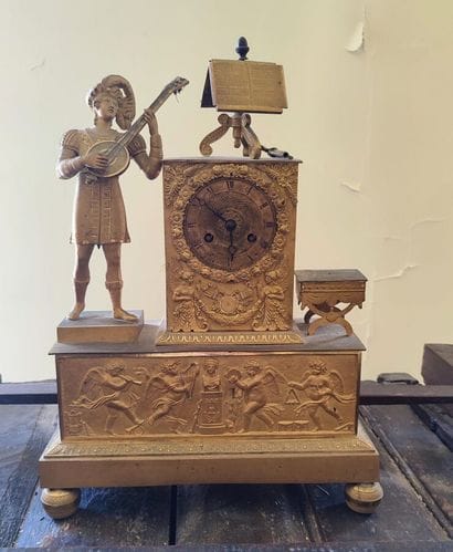 Boundary clock decorated with a musician...