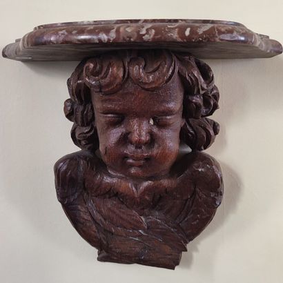 Pair of wall brackets in carved wood decorated...