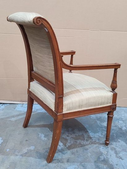Carved molded natural wood armchair in the...