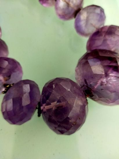 Necklace of large purple hardstone pearls
A...