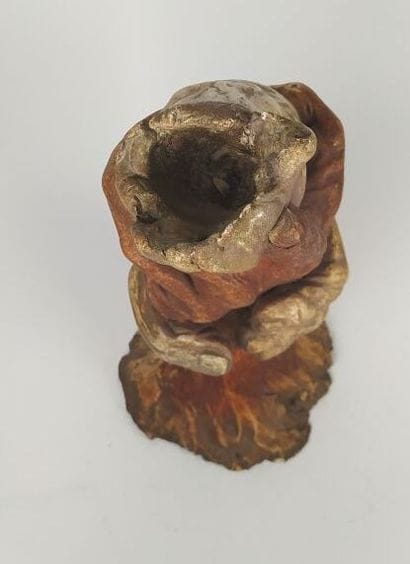 Terracotta sculpture of two embracing hands
Signed...