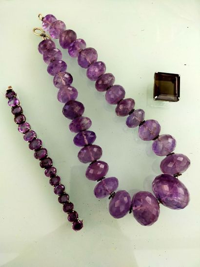Necklace of large purple hardstone pearls
A...