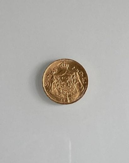 One 20 Franc gold coin, Belgium
(worn and...