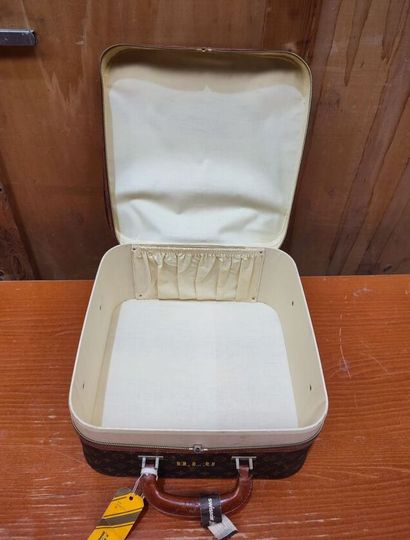 LOUIS VUITTON
Set of three small travel bags:...