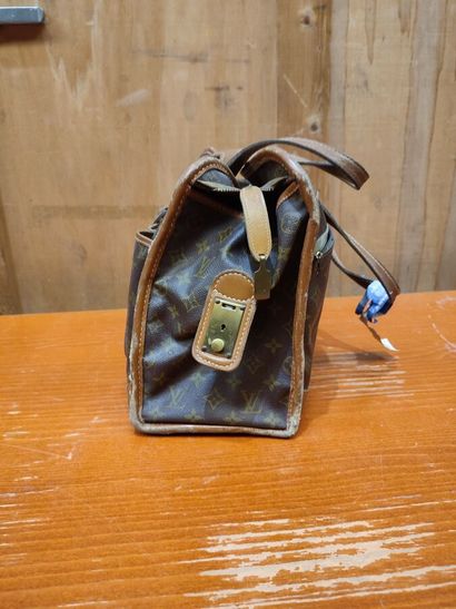 LOUIS VUITTON
Set of three small travel bags:...