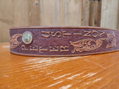 Leather belt with floral decoration and 