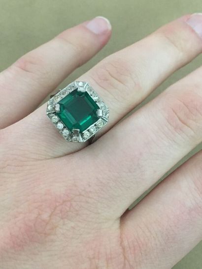 White gold ring set with a fancy green stone
Gross...