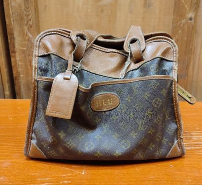 LOUIS VUITTON
Set of three small travel bags:...