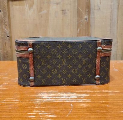 LOUIS VUITTON
Set of three small travel bags:...