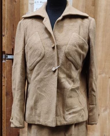 CARVEN
Beige ensemble with belted jacket,...